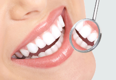 Showing a very white and beautiful teeth as a result of good hygiene